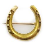 Gold horse shoe brooch, stamped 15ct Condition Report & Further Details Approx 4.