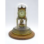 Late 19th century brass torsion clock, enamel Arabic dial, on circular oak plinth, under dome,