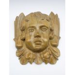 19th century pine wall mask carved as an Putti,