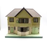 Vintage Tri-ang dolls house with some furniture,