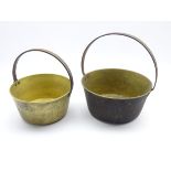 Two graduating brass jam pans,