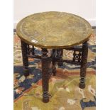 Early 20th century Eastern Benares carved hardwood table with circular brass top, D55cm,