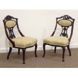 Pair Edwardian walnut nursing chairs, pierced and carved cresting rails and splats,