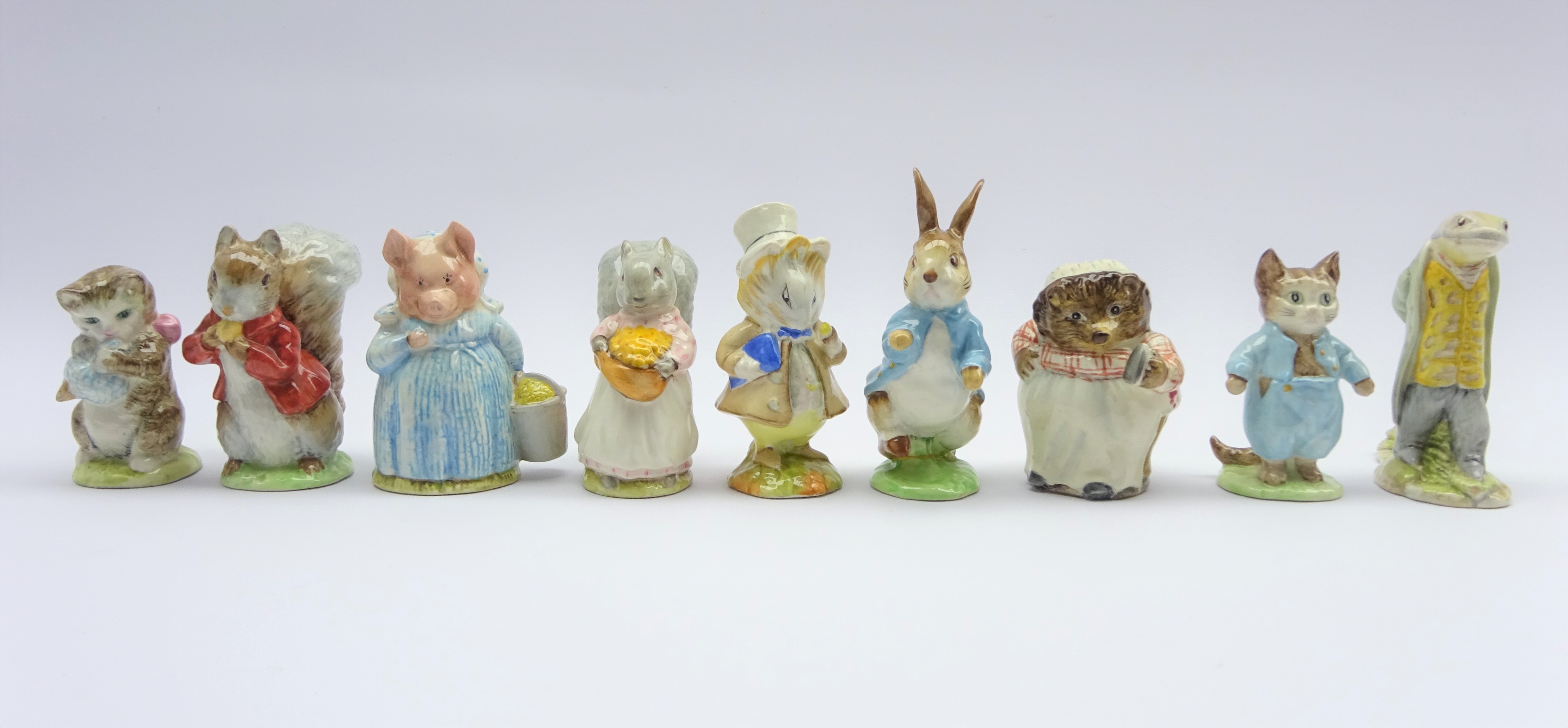 Nine Beswick Beatrix Potter figures; Mrs Tiggy Winkle, Sir Isaac Newton, Tom Kitten,