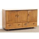 Ercol elm sideboard, three cupboards and two drawers, W130cm, H76cm,
