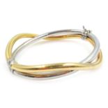 9ct white and yellow gold cross over hinged bangle, stamped 375, approx 10.