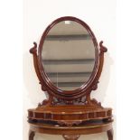 Victorian dressing table mirror, oval mirror plate in moulded frame, carved mirror supports,