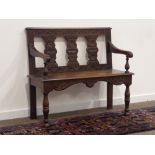 Early 20th century oak hall bench, lunette carved cresting rail above three splats,