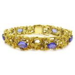 Gold openwork bark effect bracelet, set with seven oval tanzanites and round brilliant cut diamonds,