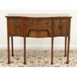 Early 19th century mahogany serpentine sideboard, three drawers and cupboard,