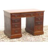 Edwardian walnut twin pedestal desk, rectangular moulded top with red leather inset, nine drawers,