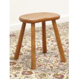 'Lizardman' oak stool, shaped seat on four octagonal splayed supports,
