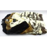 Three vintage fur jackets comprising a three quarter length Coney jacket with black leather bands,