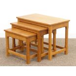 Craftsman made oak nest of three tables, carved with Thistle signature, in the 'Mouseman' style,