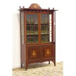 Edwardian Art Nouveau mahogany display cabinet, shaped pediment inlaid with boxwood and metal,