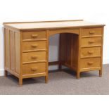 'Fishman' oak twin pedestal desk fitted with eight drawers, panelled sides,