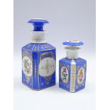 Matched pair of graduating Continental porcelain decanters and stoppers,