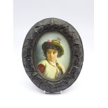 19th century Continental oval porcelain plaque hand painted with a half length portrait of a young