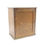 Early 20th century oak table top smokers cabinet with panelled door and fitted interior pigeonhole
