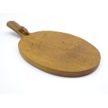 Thompson of Kilburn Mouseman oak oval cheese board with carved mouse signature,