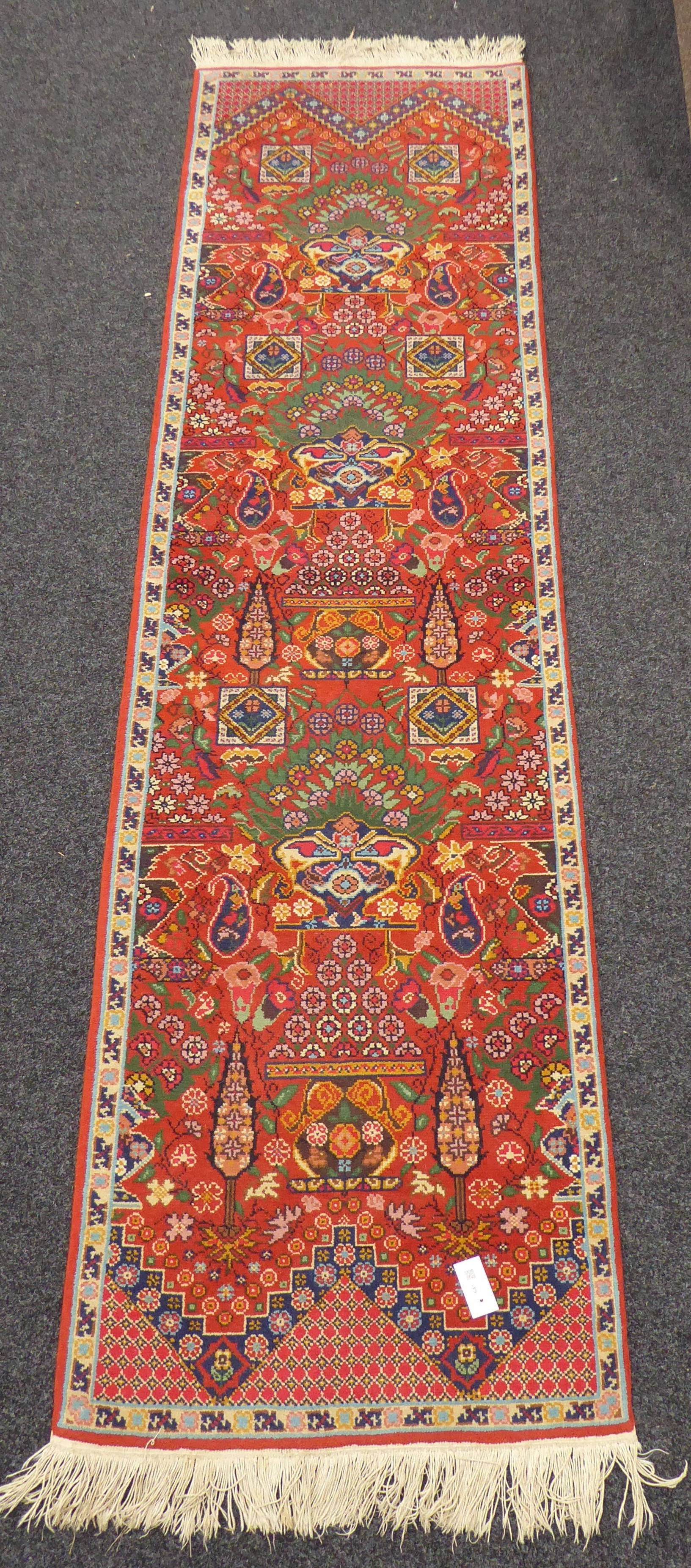 Tunisian red ground runner rug, decorated with Boteh motifs, geometric and stylised floral design,