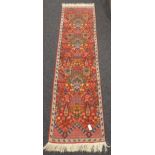 Tunisian red ground runner rug, decorated with Boteh motifs, geometric and stylised floral design,