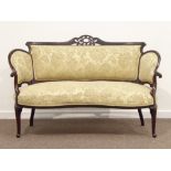 Edwardian walnut two seat settee, pierced and carved cresting rail, shaped back and arms,