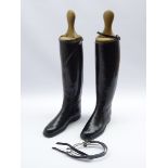 Pair black leather riding boots with tree inserts and a pair spurs, heel to toe length 27.