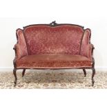 Victorian mahogany settee, shaped back carved with cartouche,