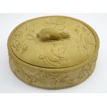 19th Century Wedgwood cane ware oval game pie dish with a raised pattern of dead game and rabbit