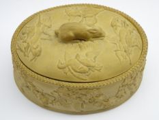 19th Century Wedgwood cane ware oval game pie dish with a raised pattern of dead game and rabbit
