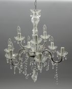 Crystal chandelier with twelve branches, candle sconces and faceted glass drops,