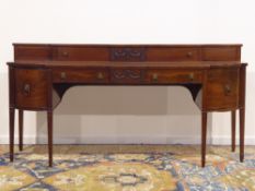 Regency mahogany sideboard, curved and canted break front top,