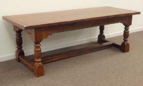 Large 18th century style oak refectory table, cleated planked top on arcade carved frieze,