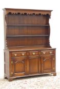 Georgian style oak dresser, raised two tier plate rack, rectangular moulded mahogany banded top,