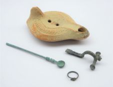 Group of Roman Antiquities; oil lamp with zoomorphic decoration, L14cm, Roman Bronze medicine spoon,