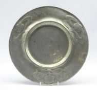 Art Nouveau circular dish, decorated in relief with stylized foliage,