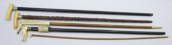 Five 19th century and early 20th century walking canes comprising two ivory handled with silver