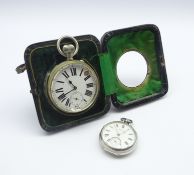 Large open face pocket watch in a silver mounted bedside frame,
