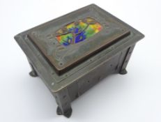 Art Nouveau copper and brass jewellery casket with enamel inset lid with all over relief floral