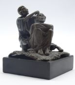 Bergman style bronze figure of a barber seated on a rug H 9cms