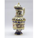 Large 19th century ewer, decorated in the Imari palette, relief moulded with trailing grape vines,