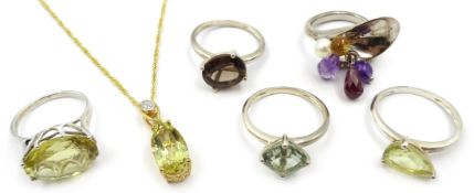 Silver-gilt citrine pendant necklace, smoky quartz ring and four other stone set rings,