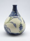 Florian Ware style vase, bulbous form with painted poppies on a graduated blue and plain ground,