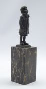 Bergman style bronze standing figure of a boy on a marbled plinth H 28cms
