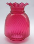 Large early 20th century cranberry glass oil lamp shade with frill rim,