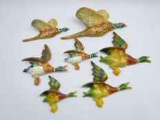 Pair Beswick graduating Pheasant wall plaques no.