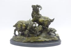 Large bronze group of a Family of Goats on rocky base, mounted on oval marble plinth,