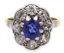 Gold oval sapphire and old cut diamond cluster ring,