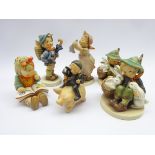 Six Goebel figures; Wash Day no. 321, Chimney Sweep Boy Riding on Pig, Bookworm no.